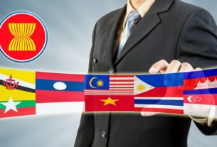 Asean Economic Community In Businessman Hand